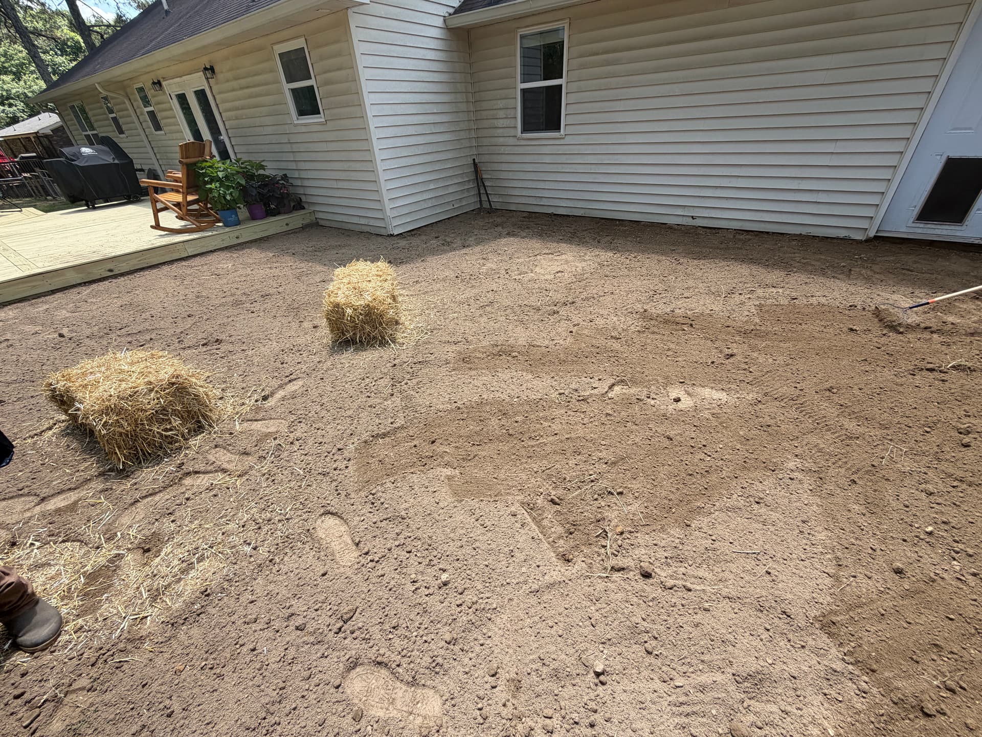 Backyard Drainage Fix and Seeding to Protect a Home's Foundation