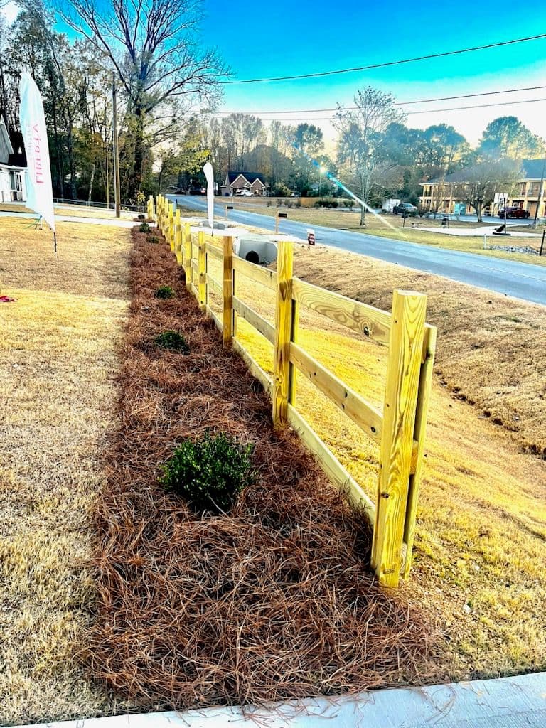 Stunning Landscape Makeover with New Wooden Fence image